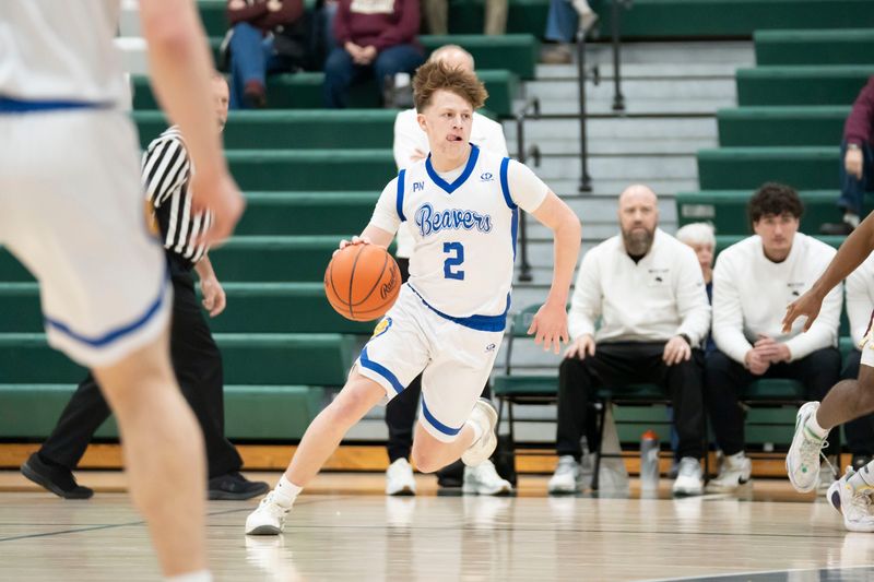 Harper Creek senior Maddox McCarty dribbles during a game against Parma Western at Pennfield High School on Monday, Feb. 23, 2026.