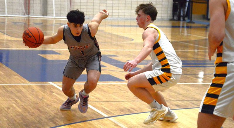 Hussein Salami of Bedford drives during a 47-45 win over Trenton in the quarterfinals of the Division 1 District at Trenton on Monday, Feb. 23, 2026.
