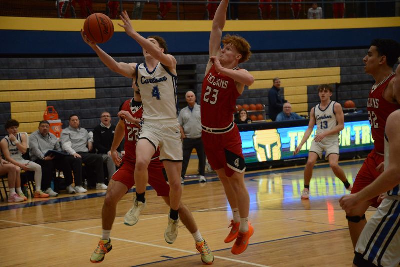 Gibraltar Carlson's Carmine Carafelli goes to the basket against Monroe's Cooper Roinson during a 47-31 Carlson victory in the quarterfinals of the Division 1 District at Trenton on Monday, Feb. 23, 2026.
