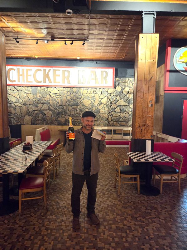 Owner Timothy Tharpe inside the renovated Checker Bar, which is reopening March 4 after being closed since January 2025.