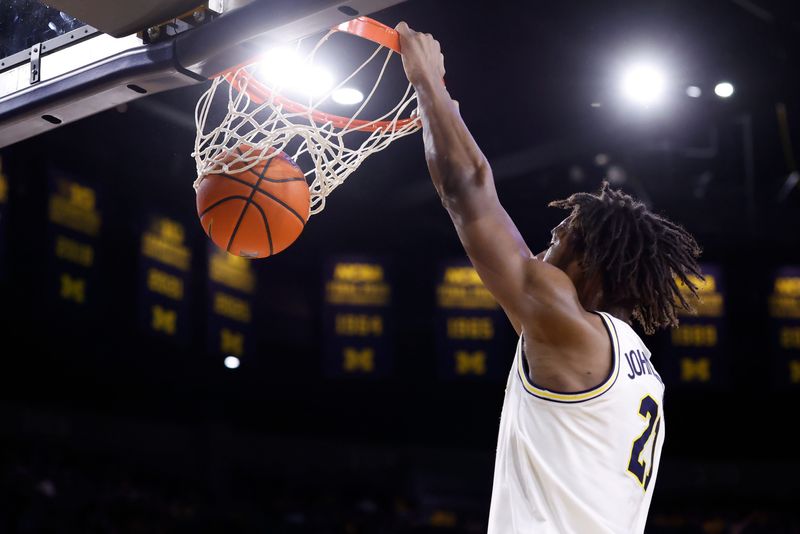 Michigan Wolverines forward Morez Johnson Jr. (21) dunks in the first half against the Minnesota Golden Gophers at Crisler Center in Ann Arbor on Tuesday, Feb. 24, 2026.