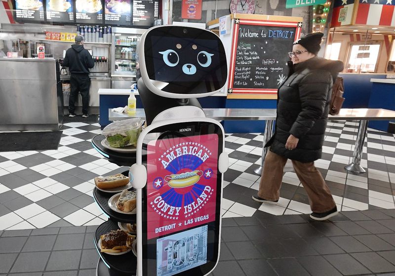Keenan Robotics, otherwise known as Alice, delivers coney dogs, fries, drinks and other menu items, on what just happens to be national chili day, to patrons at American Coney in Detroit, Michigan on February 26, 2026.