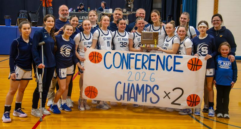 Gaylord St. Mary celebrates a 51-30 victory over Inland Lakes on Thursday, February 26, winning the program's second straight league title.