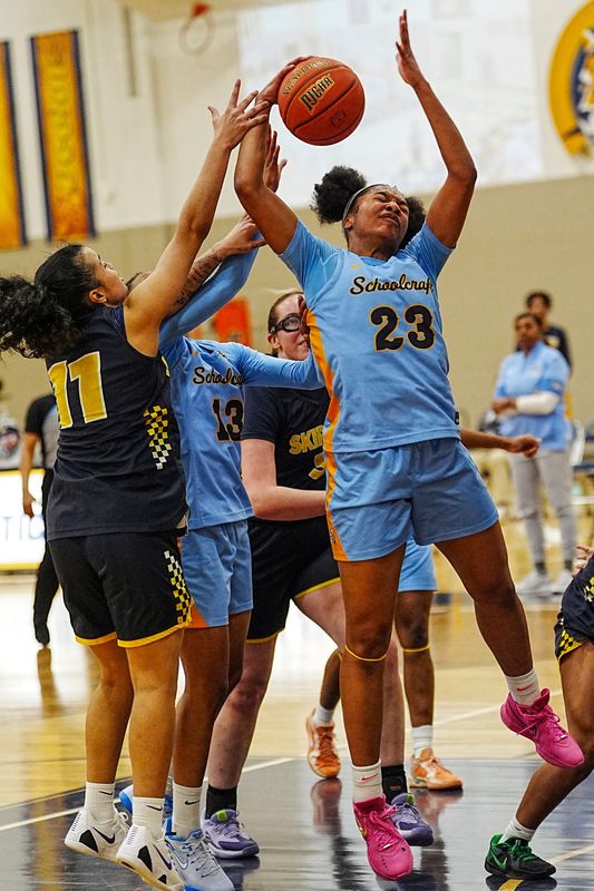 Schoolcraft College’s Briana Young (23) grabs the rebound and shoots two against St. Clair County Community College’s Soleil DeJesus (11) during the last game of the season at Schoolcraft College in Livonia on Feb. 24, 2026. Schoolcraft defeated St. Clair Community College to remain undefeated for the season with a record of 28-0.