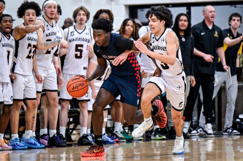 East Lansing's KJ Torbert, left, moves the ball as Waverly's Cayden Ali defends during the fourth quarter on Friday, Feb. 27, 2026, at Waverly High School.