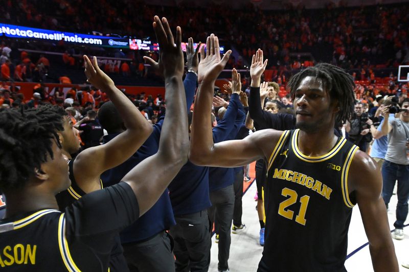Michigan Wolverines players celebrate a 84-70 win over the Illinois Fighting Illini at State Farm Center in Champaign, Illinois, on Friday, Feb. 27, 2026.