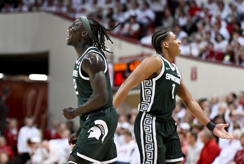 Mar 1, 2026; Bloomington, Indiana, USA; Michigan State Spartans guard Jeremy Fears Jr. (1) and Michigan State Spartans guard Kur Teng (2) celebrate against the Indiana Hoosiers during the first half at Simon Skjodt Assembly Hall. Mandatory Credit: Robert Goddin-Imagn Images
