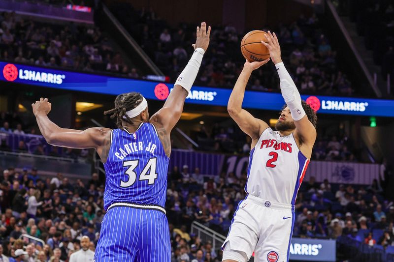 Detroit Pistons guard Cade Cunningham (2) shoots against Orlando Magic center Wendell Carter Jr. (34) during the first quarter at Kia Center in Orlando, Florida, on Sunday, March 1, 2026.
