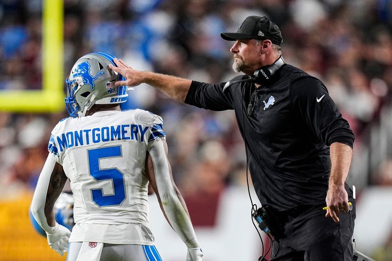 Detroit Lions head coach Dan Campbell celebrates a 2-point conversion against the Washington Commanders scored by running back David Montgomery during the first half at Northwest Stadium in Landover, Md. on Sunday, Nov. 9, 2025.