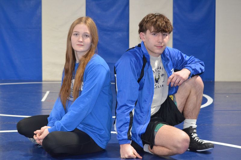 Harper Creek wrestlers Alexandra Stiltner, left, and Devan Garcia head into the MHSAA state individual wrestling finals among the favorites to win a state title in their weight class.