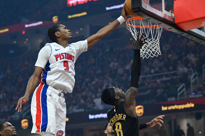 Mar 3, 2026; Cleveland, Ohio, USA; Detroit Pistons guard Ausar Thompson (9) blocks a shot by Cleveland Cavaliers guard Dennis Schroder (8) in the third quarter at Rocket Arena. Mandatory Credit: David Richard-Imagn Images