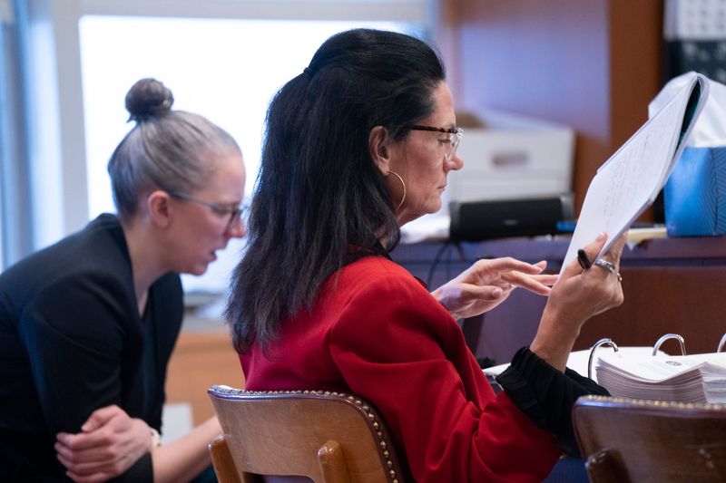 Judge Kirsten Nielsen Hartig looks through her notes at right as Judge Jennifer Mazzuchi of Marquette presides over Oakland County Judge Kirsten Nielsen Hartig’s ongoing professional misconduct hearing as Chief Oakland County 52nd District Court Judge Travis Reeds testifies against Judge Kirsten Nielsen Hartig in Wayne County Probate Court on Tuesday, March. 3, 2026.