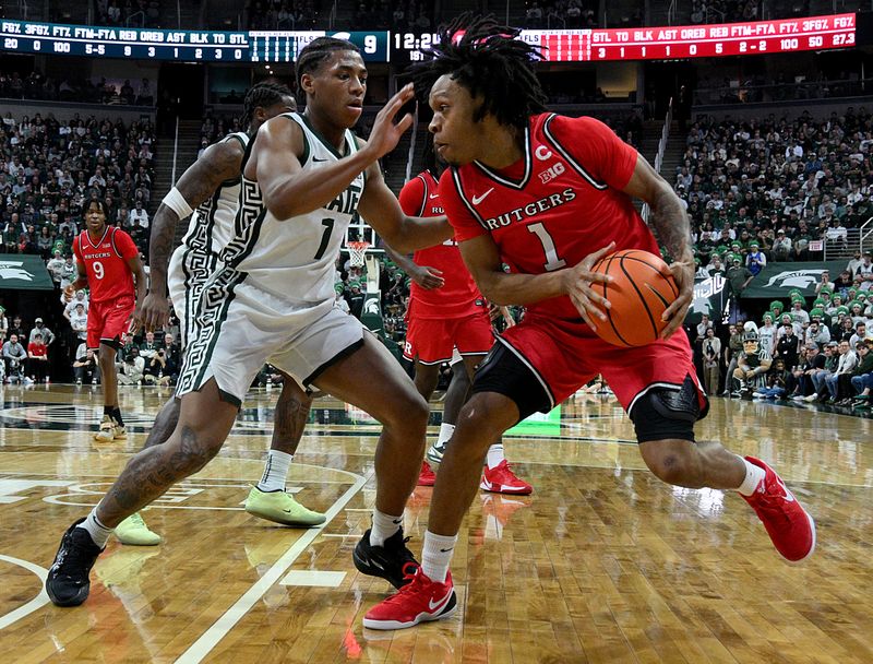 Mar 5, 2026; East Lansing, Michigan, USA; Michigan State Spartans guard Jeremy Fears Jr. (1) defends on Rutgers Scarlet Knights guard Jamichael Davis (1) during the first half at Jack Breslin Student Events Center.