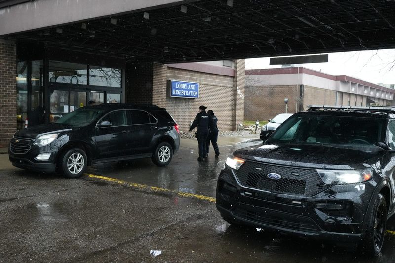 Members of the Lansing Police Department entered the Causeway Bay Lansing Hotel & Convention Center, Thursday, March 5, 2026.
