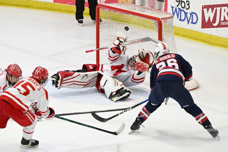 Orchard Lake St. Mary's goalie Thomas Reeder makes a save from his backside on a shot on goal from Grosse Pointe Woods University Liggett's Nick Gould in the first period of the Division 3 state semifinal Friday at USA Hockey Arena in Plymouth Township.
