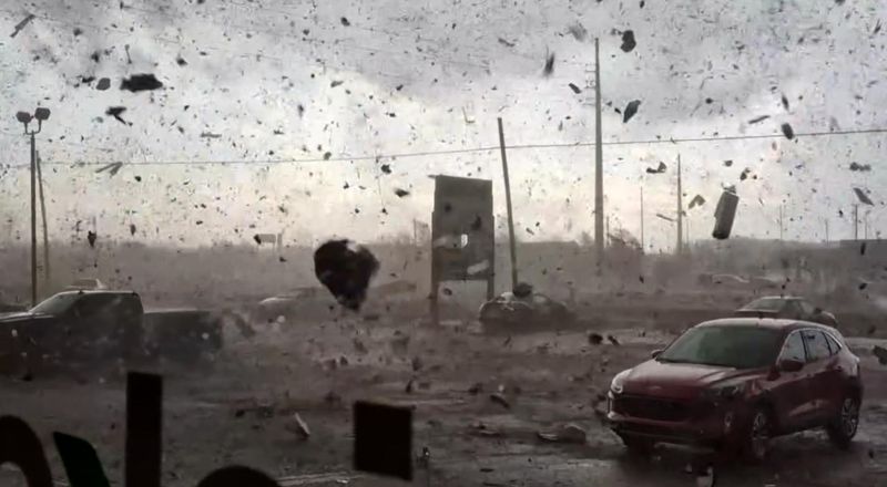 Kainan Hix of Three Rivers filmed the tornado ripping across US-131 through the parking lot of commercial strip mall from inside a Cricket Wireless store on Friday, March 6, 2026 in Three Rivers, Mich.