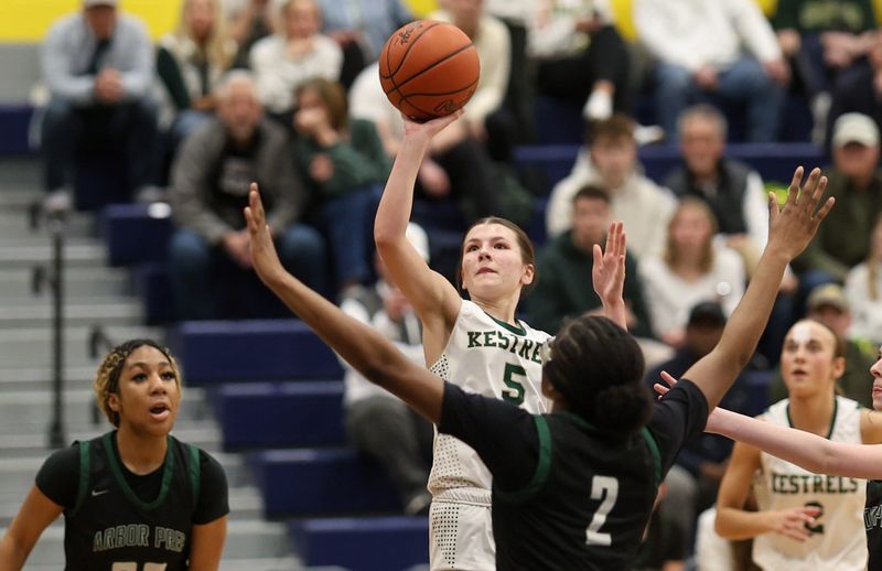 St. Mary Catholic Central's Gracelyn Carter shoots over the Ypsilanti Arbor Prep defense during a 51-27 SMCC victory in the finals of the Division 3 District at Whiteford on Friday, March 6, 2026.