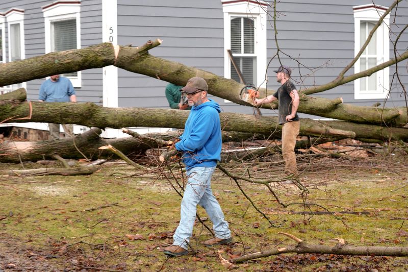 Many trees are down on the lawns and front yards of historic homes, some with damage, on North Broadway Street in downtown Union City on Saturday, March. 7, 2026. A tornado hit the area on Friday, March 6.