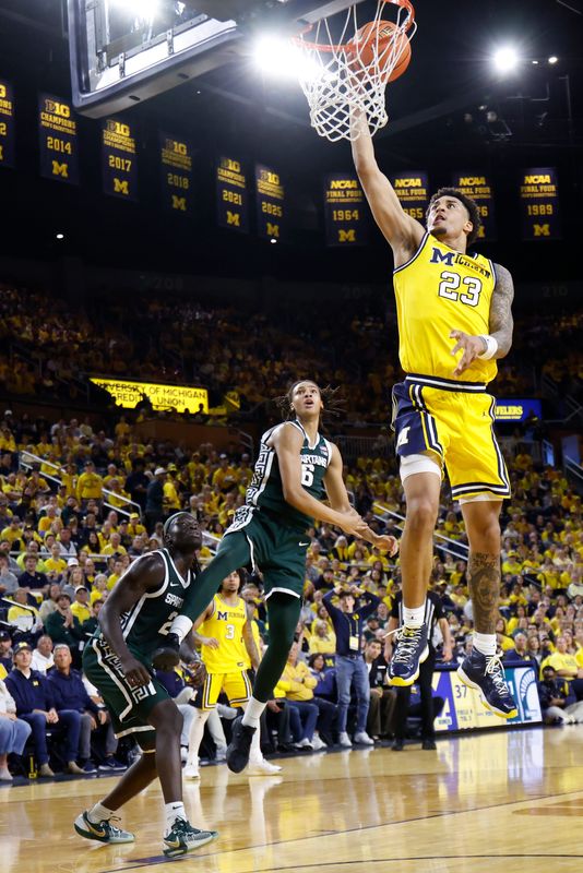 Mar 8, 2026; Ann Arbor, Michigan, USA; Michigan Wolverines forward Yaxel Lendeborg (23) shoots on Michigan State Spartans forward Jordan Scott (6) in the first half at Crisler Center. Mandatory Credit: Rick Osentoski-Imagn Images
