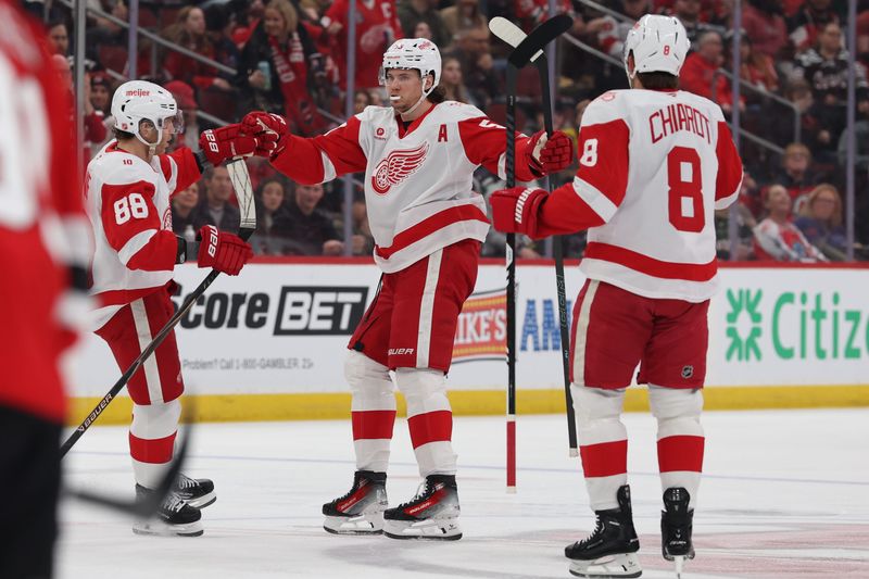 Detroit Red Wings defenseman Moritz Seider (53) celebrates his goal against the New Jersey Devils during the first period at Prudential Center.