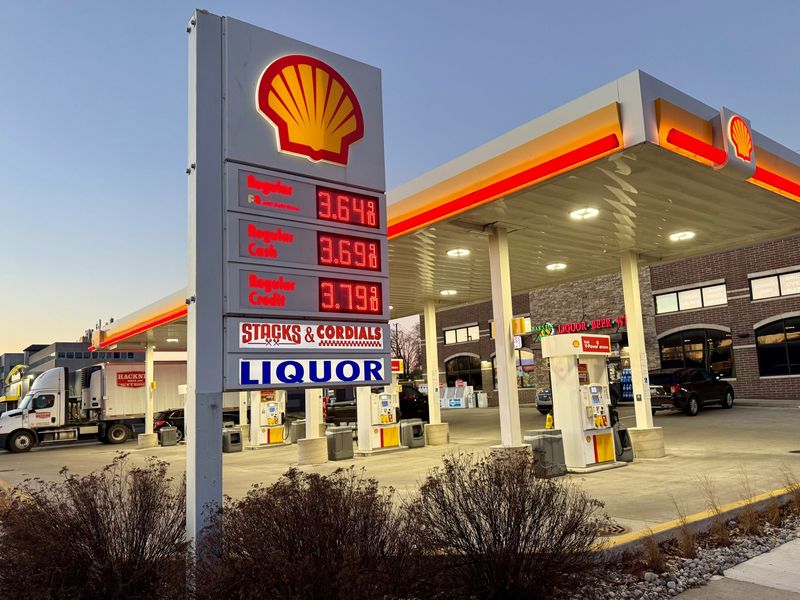 Gas prices dropped slightly on Monday in Michigan. Motorists fuel up on gas at the Shell station off Woodward in Royal Oak.