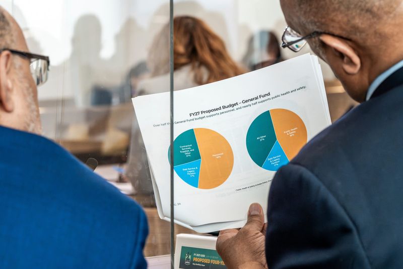 People look over Detroit Mayor Mary Sheffield’s first four-year financial plan as mayor at the Coleman A. Young Municipal Center in Detroit on Monday, March 9, 2026.