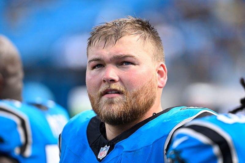 Sep 21, 2025; Charlotte, North Carolina, USA; Carolina Panthers center Cade Mays (64) on the sidelines in the fourth quarter at Bank of America Stadium. Mandatory Credit: Bob Donnan-Imagn Images