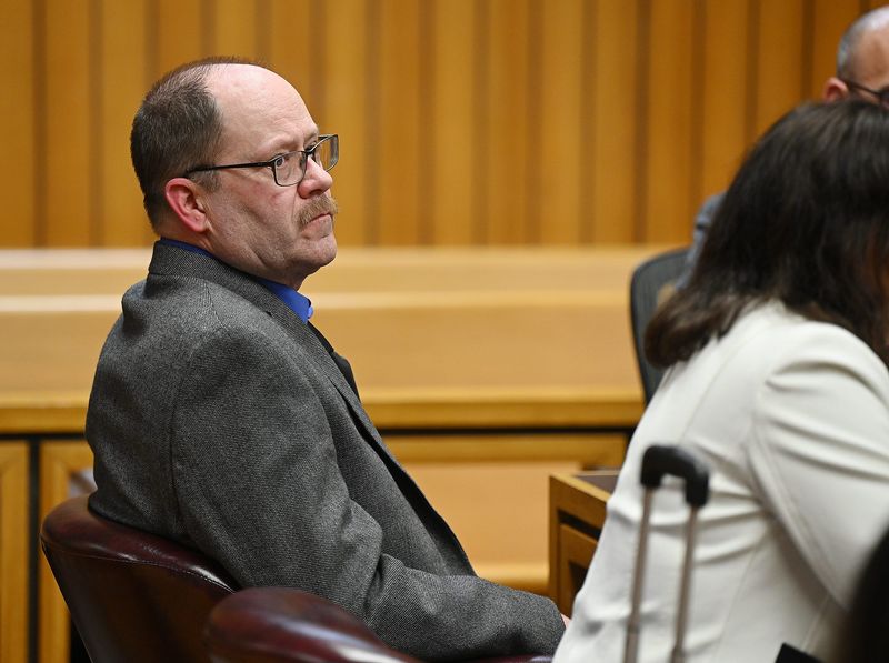 Dale Warner listens after he was found guilty of second-degree murder and tampering in the death of his wife, Dee Warner, on March 10, 2026, in Adrian, Michigan.