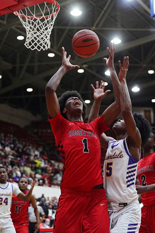 Roseville’s Carter George (1) fights for the rebound against Auburn Hills Avondale’s Jakobe Liford (5) during the first half of the MHSAA Division 1 quarterfinals at Calihan Hall in Detroit, Tuesday, March 10, 2026.