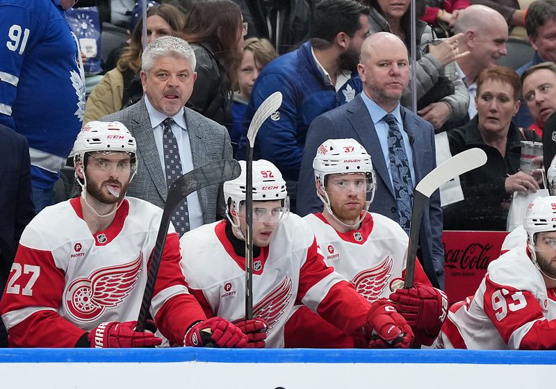 Apr 17, 2025; Toronto, Ontario, CAN; Detroit Red Wings head coach Todd McLellan watches the play against the Toronto Maple Leafs during the third period at Scotiabank Arena. Mandatory Credit: Nick Turchiaro-Imagn Images