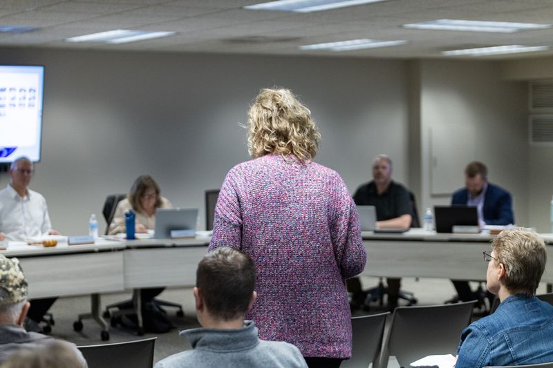 A resident speaks during public comment about a proposed solar development in Zeeland Township on Tuesday, March 10.
