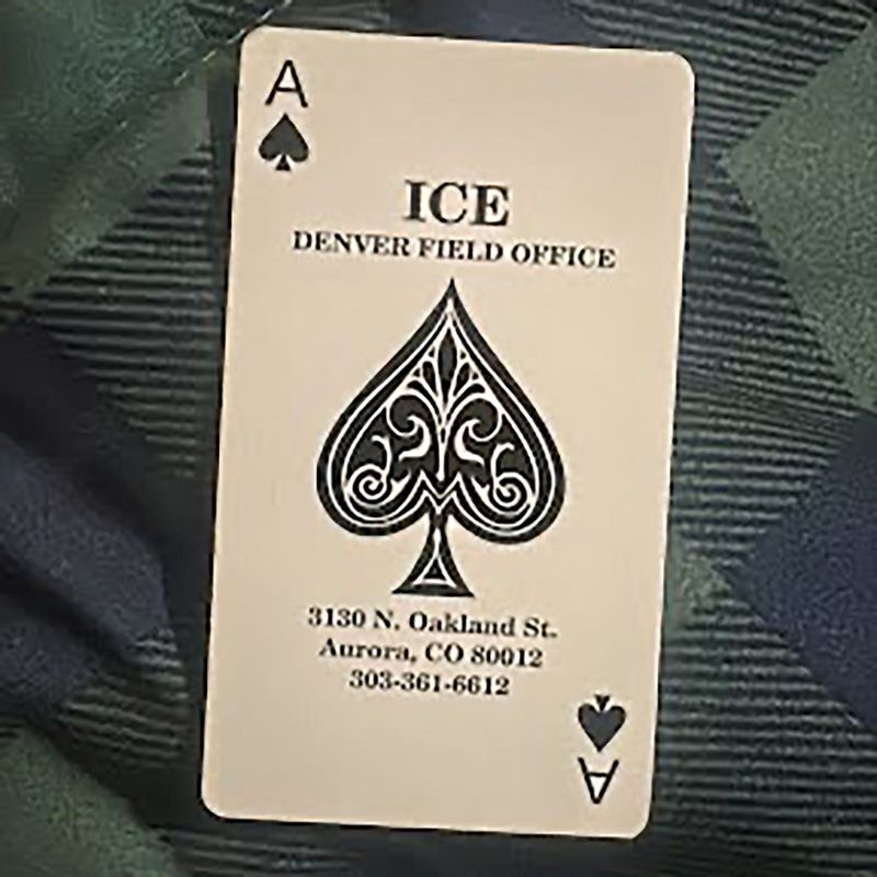 A photo provided by a family to the immigrant-rights group Voces Unidas shows an ace of spades card that was one of several that the group says were left in the vehicles of people detained by U.S. immigration authorities on Jan. 21, 2026, in Eagle County, Colorado, Immigration and Customs Enforcement's Denver field office is printed on the card, along with the address of its Aurora detention center.