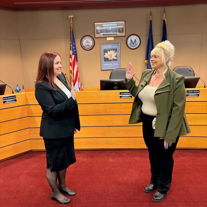 Jenna Morse (left) is sworn-in as interim Monroe County drain commissioner by Annamarie Osment, Monroe County clerk.
