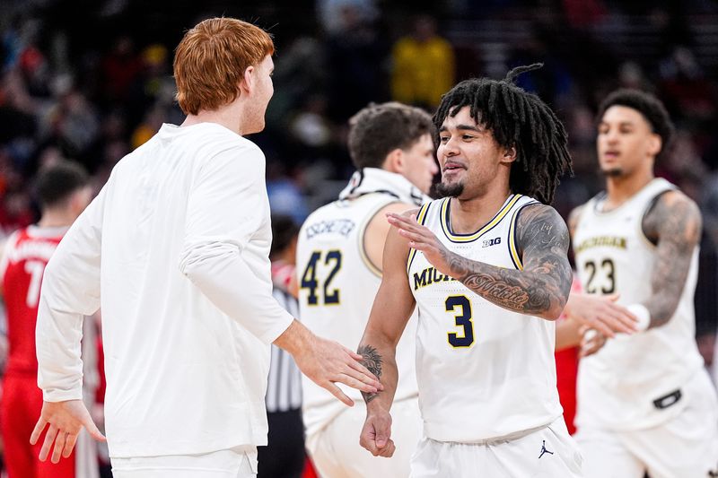 Michigan guard Elliot Cadeau (3) celebrates a play against Ohio State during the first half of Big Ten tournament quarterfinal at United Center in Chicago on Friday, March 13, 2026.