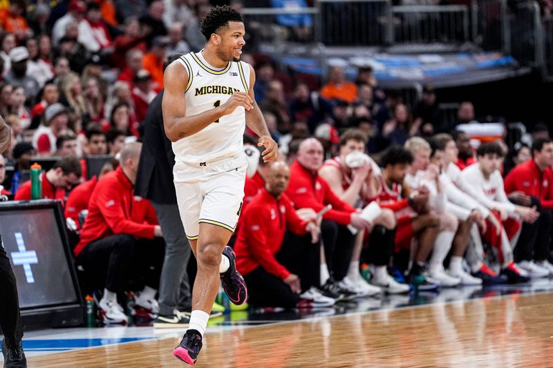 Michigan guard Trey McKenney (1) celebrates a basket against Ohio State during the first half of Big Ten tournament quarterfinal at United Center in Chicago on Friday, March 13, 2026.