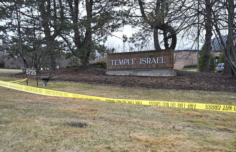 Yellow police tape blocks the entrance to the Temple Israel synagogue is block on March 13, 2026, in West Bloomfield Township, Mich., one day after a man intentionally drove at truck into the building.