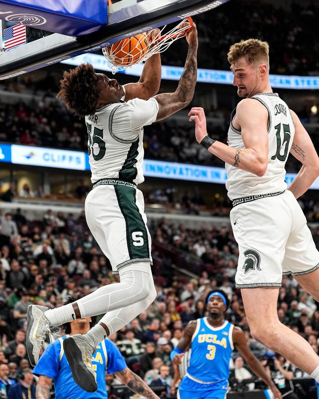Michigan State forward Coen Carr (55) dunks against UCLA during the first half of Big Ten tournament quarterfinal at United Center in Chicago on Friday, March 13, 2026.