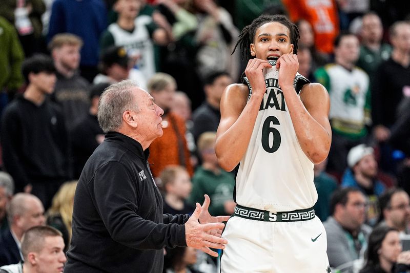 Michigan State head coach Tom Izzo talks to forward Jordan Scott (6) after a play against UCLA during the second half of Big Ten tournament quarterfinal at United Center in Chicago on Friday, March 13, 2026.