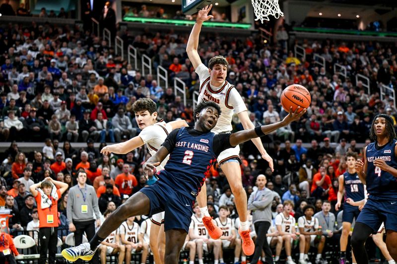 East Lansing's KJ Torbert, center, shoots against Rockford during the first quarter of the D1 boys basketball state final on Saturday, March 14, 2026, at the Breslin Center in East Lansing.
