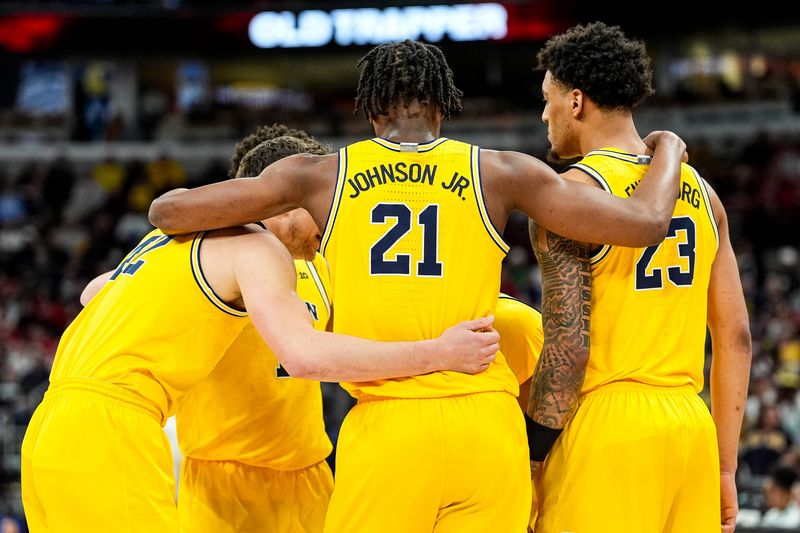 Michigan players huddle before a play against Wisconsin during the first half of Big Ten Tournament semifinal at United Center in Chicago on Saturday, March 14, 2026.