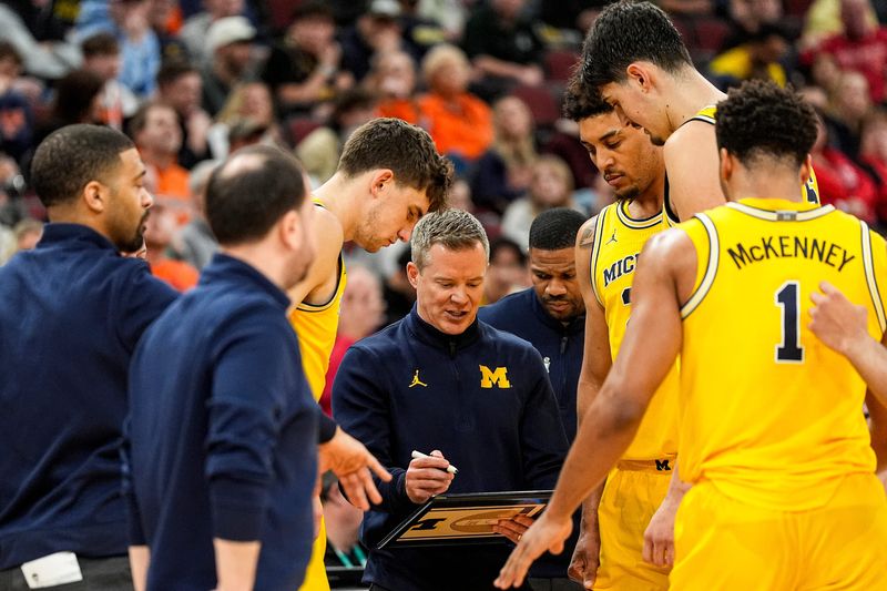 Michigan head coach Dusty May talks to players at a timeout against Wisconsin during the second half of Big Ten Tournament semifinal at United Center in Chicago on Saturday, March 14, 2026.