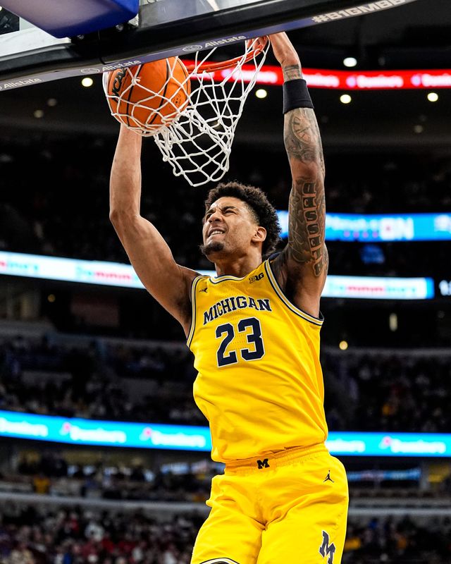 Michigan forward Yaxel Lendeborg (23) dunks against Wisconsin during the second half of Big Ten Tournament semifinal at United Center in Chicago on Saturday, March 14, 2026.