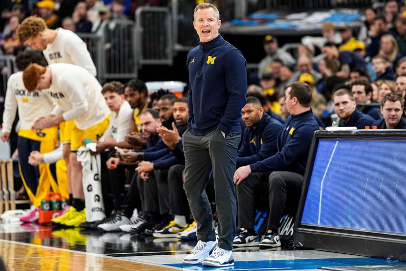 Michigan head coach Dusty May reacts to a play against Wisconsin during the first half of Big Ten Tournament semifinal at United Center in Chicago on Saturday, March 14, 2026.