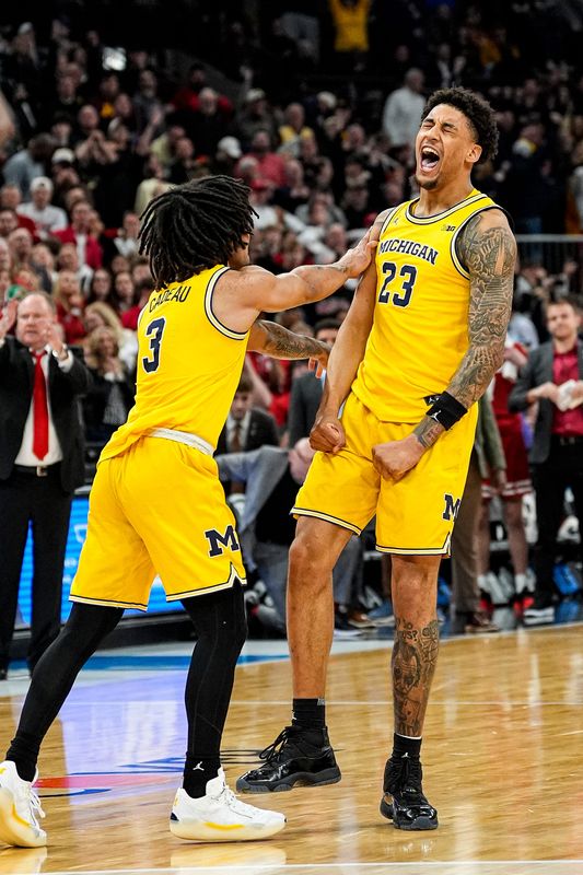 Michigan forward Yaxel Lendeborg (23) celebrates a 3-pointer against Wisconsin with guard Elliot Cadeau (3) during the second half of Big Ten Tournament semifinal at United Center in Chicago on Saturday, March 14, 2026.