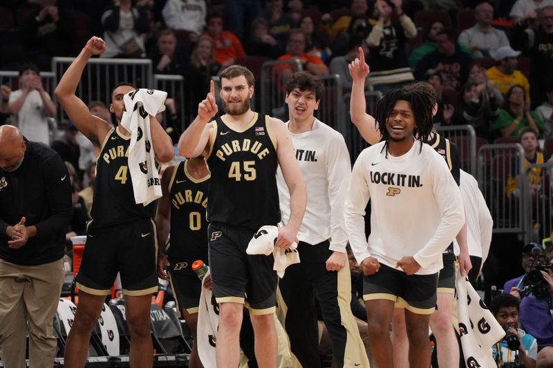 The Purdue Boilermakers bench celebrates a play against the UCLA Bruins during the second half.