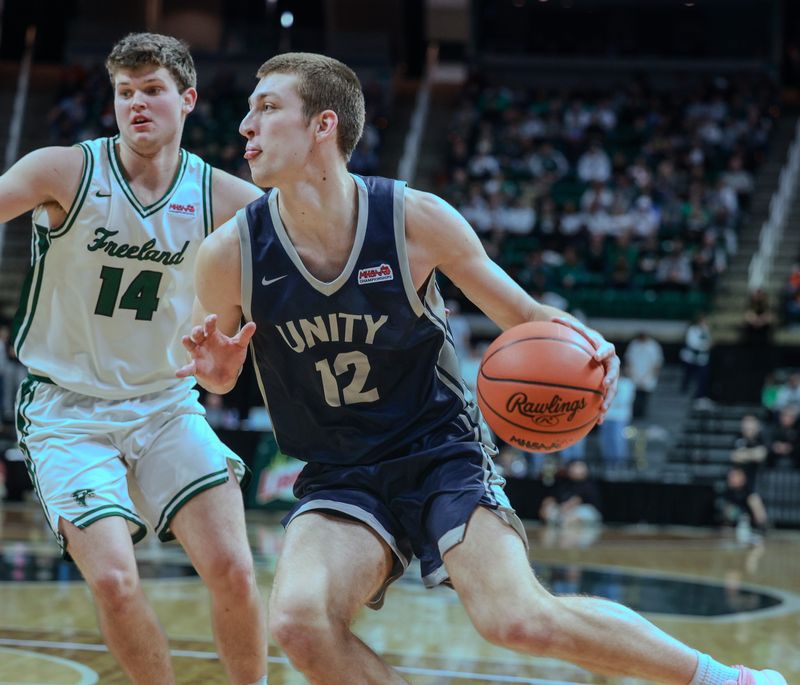 Unity Christian's Owen VanderWaal drives to the basket against Freeland in the Division 2 state finals on Saturday, March 14, at the Breslin Center in East Lansing.