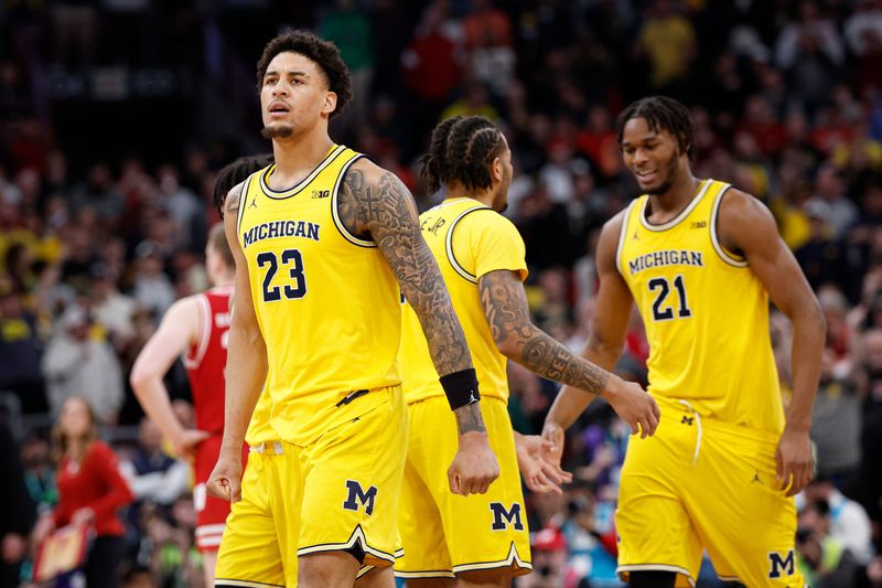 Michigan basketball forward Yaxel Lendeborg (23) reacts after scoring a game-winning basket against the Wisconsin Badgers during the second half at United Center. Mandatory Credit: Kamil Krzaczynski-Imagn Images