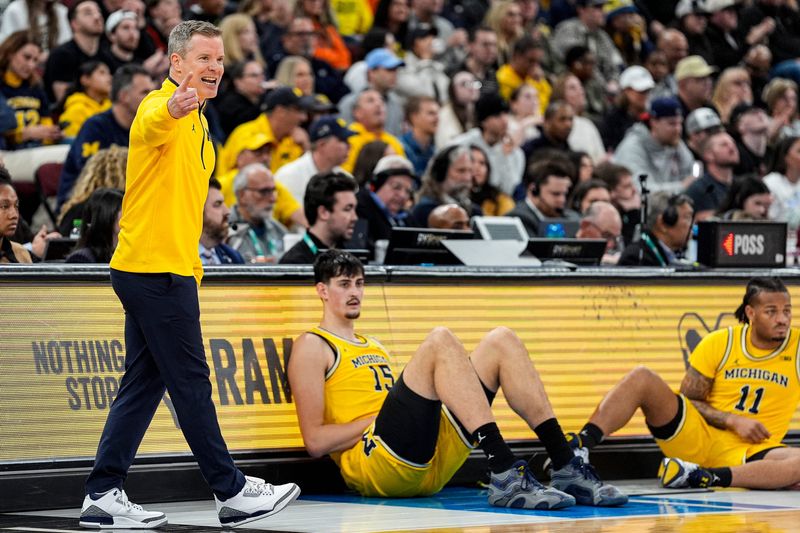 Michigan head coach Dusty May reacts to a play against Purdue during the first half of Big Ten Tournament final at United Center in Chicago on Sunday, March 15, 2026.