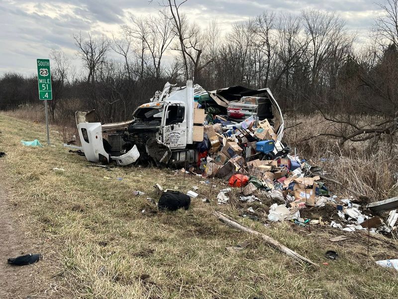 Northfield Township Fire Department officials said this commercial truck was hauling household items when it crashed and rolled over Sunday on U.S. 23.