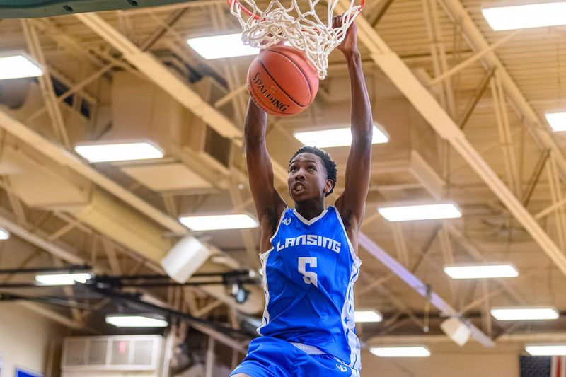 Lansing Community College freshman Shannon Henderson dunks for two of his 18 points during the Stars' win in their opening game at the NJCAA Division II National Championships on Monday, March 16, in Danville, Illinois.